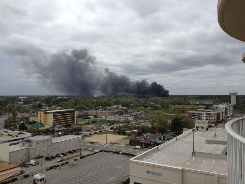 iReporter David Bryan saw smoke from his hotel balcony in Virginia Beach and shot this photo. "You could smell the jet fuel, and all we could see was the black smoke," he said. 