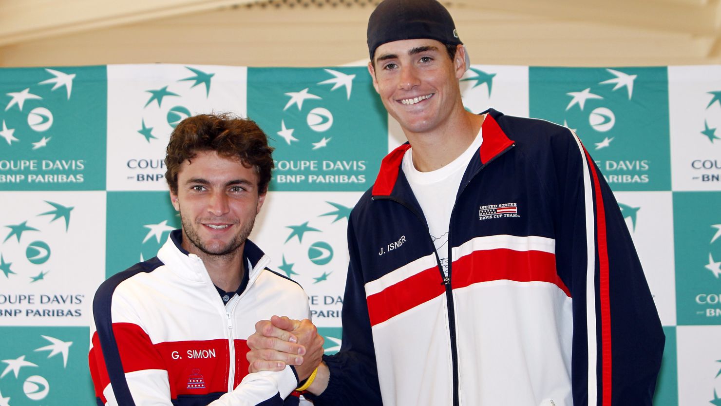 America's John Isner (right) beat Gilles Simon in straight sets to tie the Davis Cup World Group quarterfinal on Friday