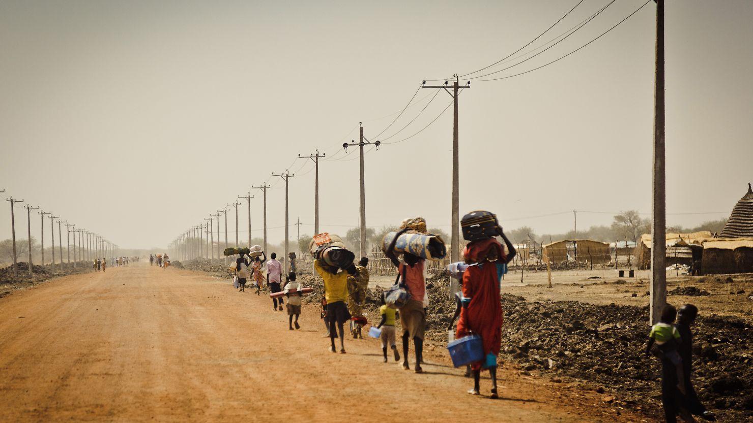 Sudanese people flee the disputed oil-rich Abyei area on March 2, 2011, before the independence of South Sudan on July 9.