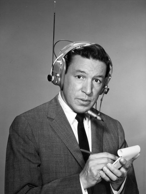 A 1964 promotional portrait shows Wallace wearing a wireless microphone. He anchored "CBS Morning News With Mike Wallace" and covered most of the major news stories of the 1960s, including several assignments to Vietnam, according to the "60 Minutes" website.