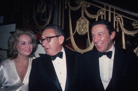 Barbara Walters,  Henry Kissinger and  Wallace pose for a photo at the Waldorf Astoria Hotel in New York City in 1980. 