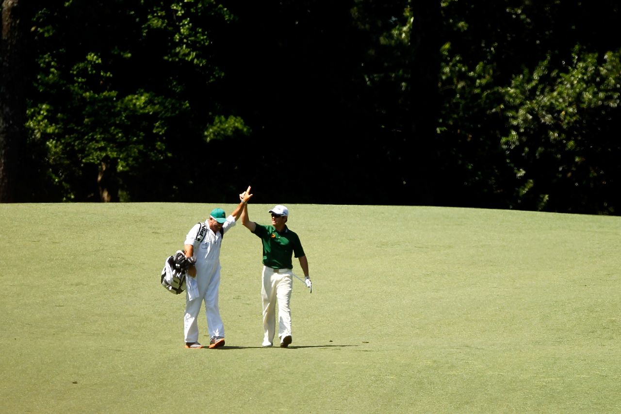 Louis Oosthuizen celebrates his double eagle from the second fairway in the final round of the Masters at  Augusta National.
