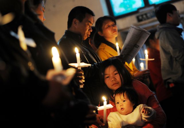Chinese Catholics pray as they attend an Easter service at the historic South Cathedral in Beijing on Saturday.