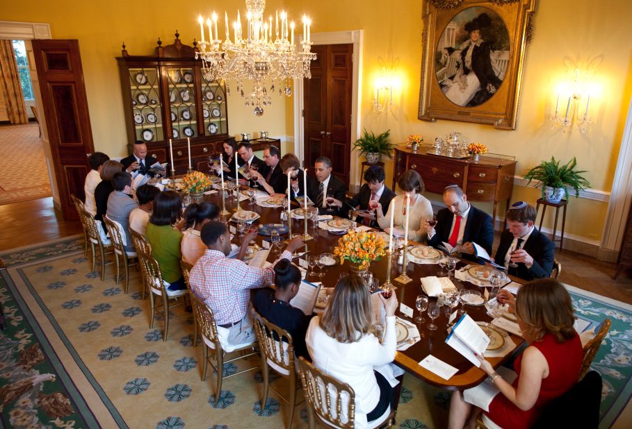 President Barack Obama and first lady Michelle Obama host a Passover Seder dinner for family, friends and staff in the Old Family Dining Room at the White House on Friday.