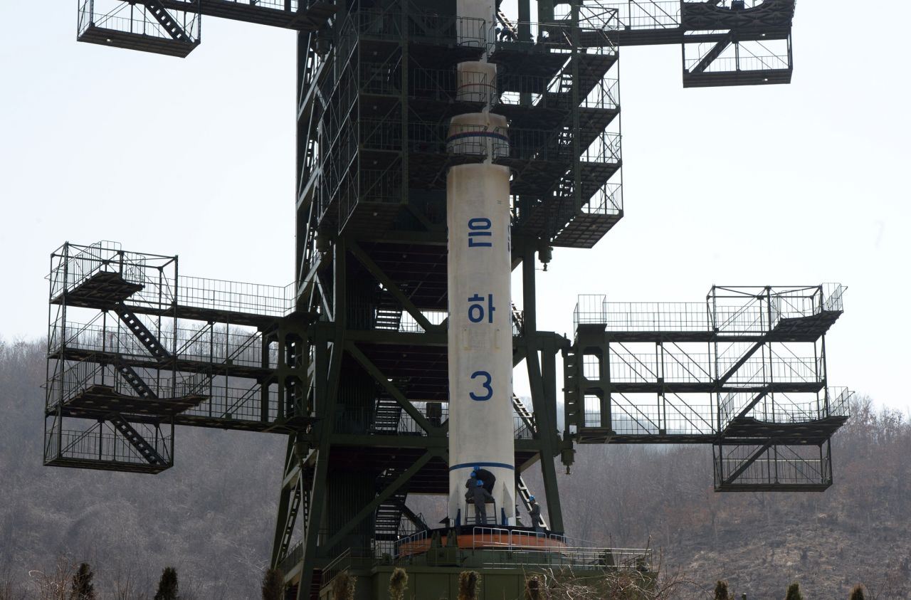 North Korean technicians check the Unha-3 rocket at Tangachai-ri space center on Sunday, April 8.