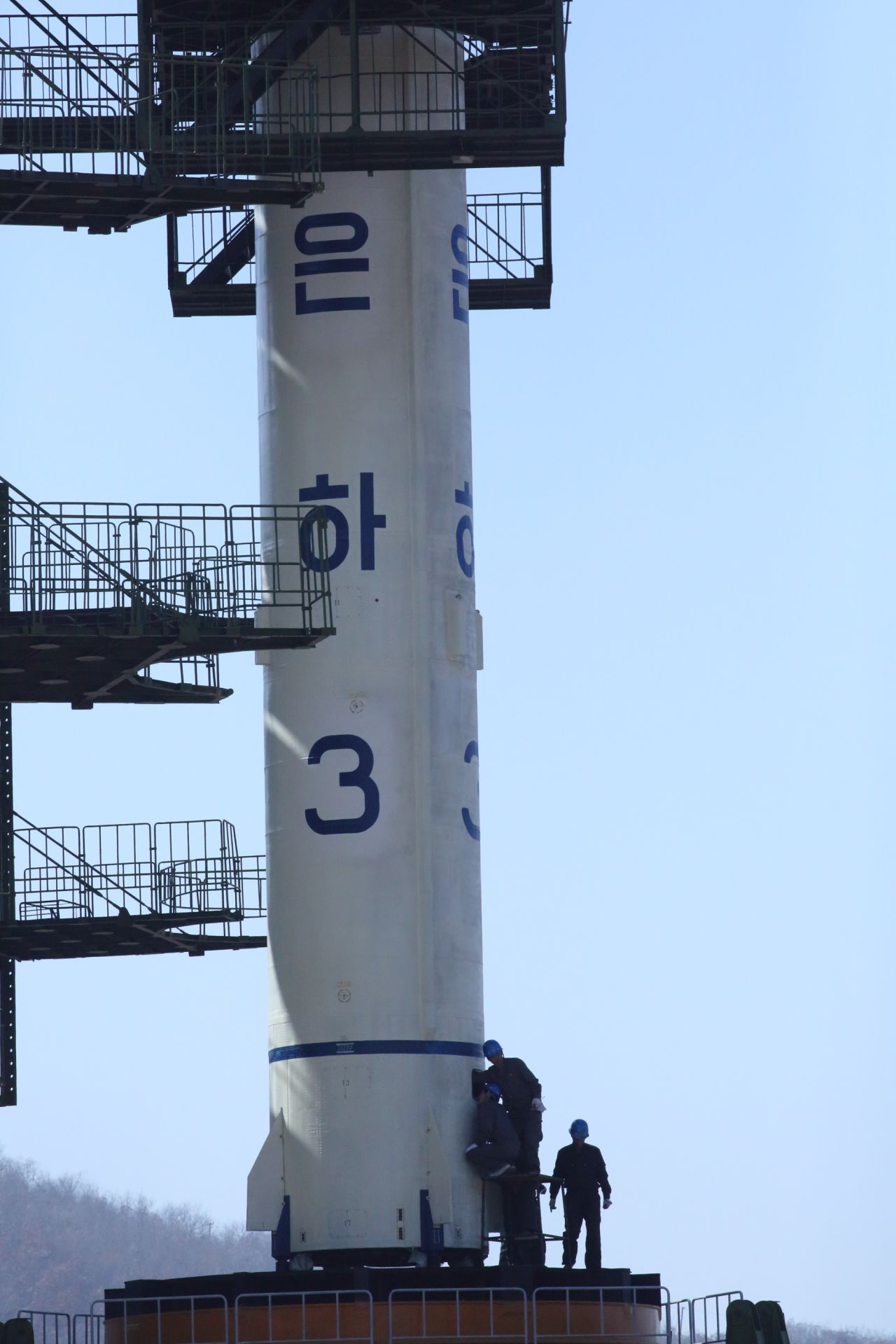 Technicians check the North Korean satellite launch vehicle Unha-3 on the launch pad at the Sohae Satellite Launching Center on April 8.