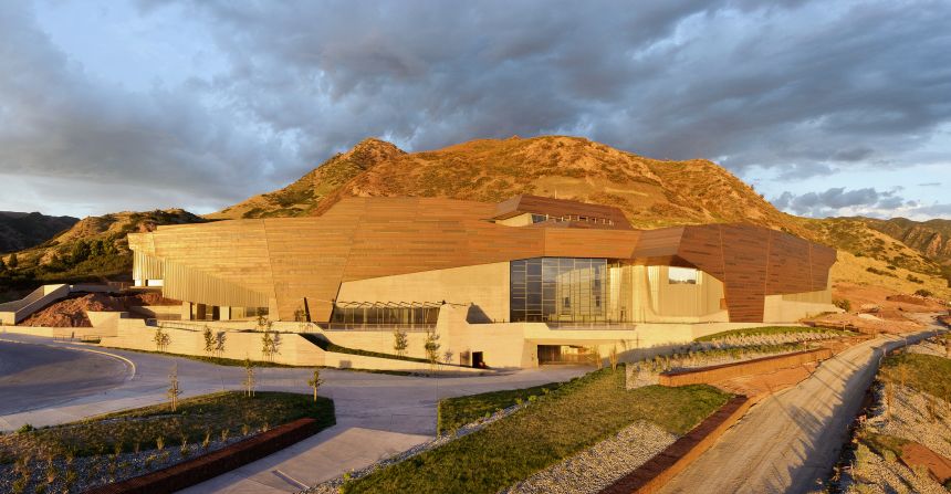 The setting sun illuminates the copper façade on the Rio Tinto Center, the Natural History Museum of Utah's new building. The copper is offset in sections to represent the state's geology. 