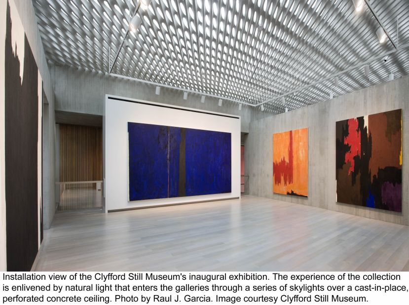 The Clyfford Still Museum's design allows natural light to enter the galleries through a series of skylights over a perforated concrete ceiling. 