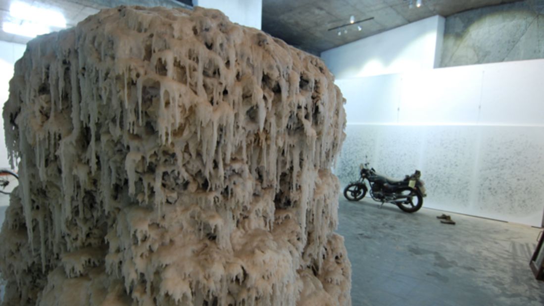 A wax-covered stalagmite of stacked calligraphy sits in the Yangjiang Group's studio.