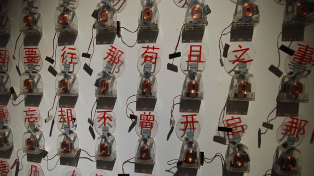 A kinetic artwork of moving Chinese characters recounts a news story.
