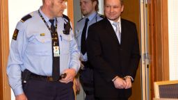 Right-wing extremist Anders Behring Berivik (R) arrives in court in Oslo on February 6, 2012.
