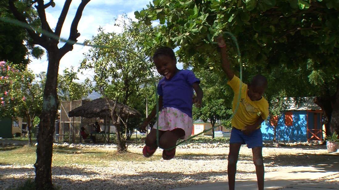 Lavita enjoys a game of jump rope at the New Life center. 
