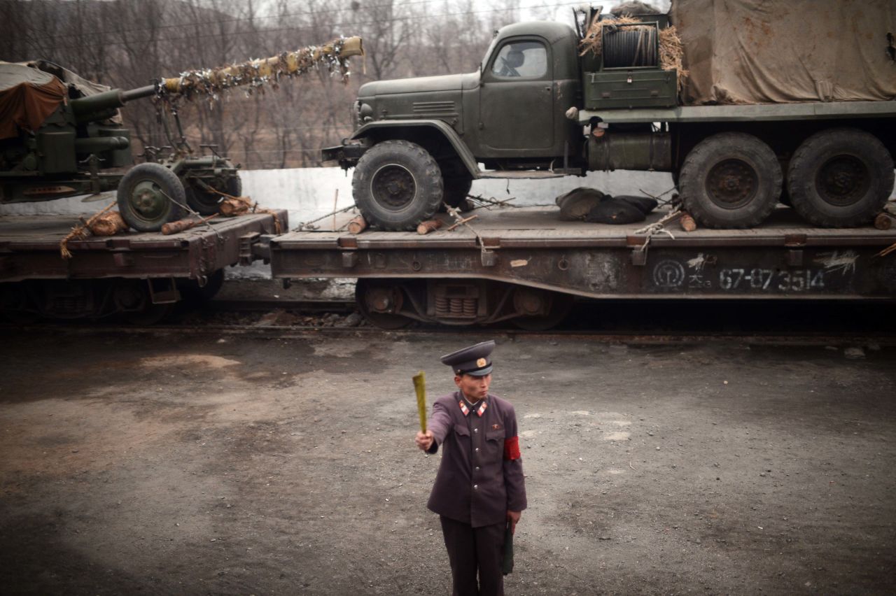 A controller is seen from the window of a train along the railway on the west coast Sunday. A controversial missile launch is expected to take place in the coming days. Pyongyang insists it has no bad intentions and invited foreign journalists to view its launch site.