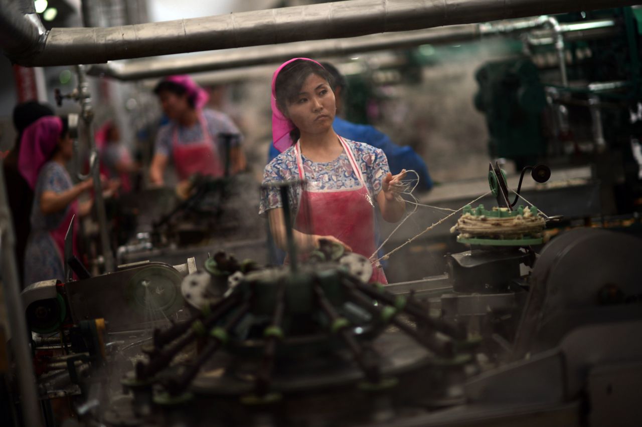 Employees work in a textile factory in Pyongyang. 