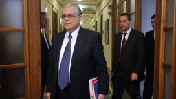 Greek Prime Minister Lucas Papademos arrives for the cabinet meeting at the Greek Parliament in Athens on April 11, 2012. 