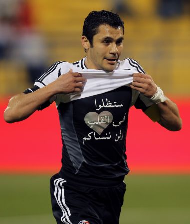 Ahmed Hassan displays a shirt with the message "You will remain in our hearts and we will never forget you" in reference to victims of the Port Said tragedy. His former club Al-Ahly had played in the match against Al-Masry where fans rioted.