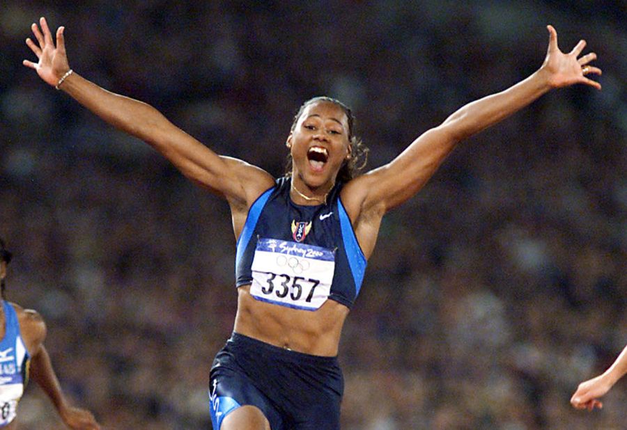 Marion Jones crosses the line first in the 100m final at the 2000 Olympics. It was one of three golds the American sprinter won in Sydney. In 2007, Jones admitted to taking banned substances and was stripped of her medals. 