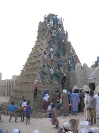 In this archive picture, locals climb the Sankore Mosque. This week, UNESCO issued new calls for the protection of Timbuktu. "Mali's cultural heritage is a jewel whose protection is important for the whole of humanity," said UNESCO director-general Irina Bokova.