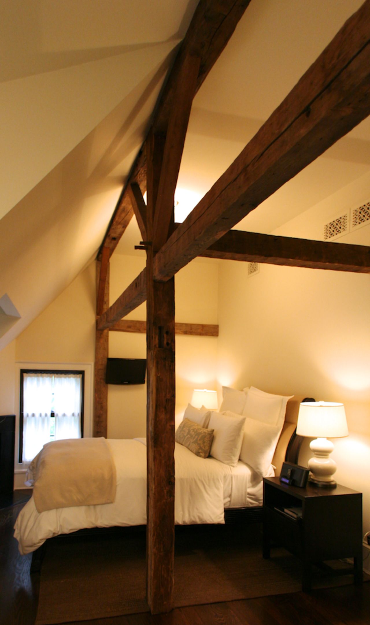 Wood beams from the building's original structure, dating back to the 18th century, have been retained.