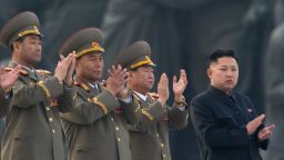 North Korean leader Kim Jong-Un (R) claps during a ceremony in Pyongyang on April 13, 2012