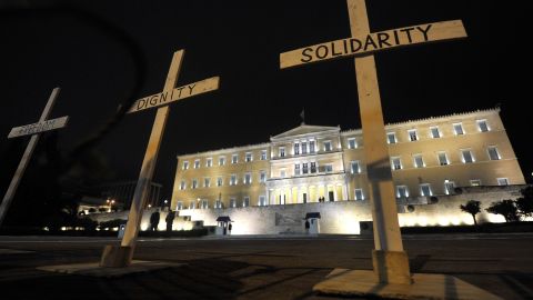 Crosses in front of the Greek parliament on April 8, 2012, in Athens. Protesters gathered after a retired pharmacist killed himself.