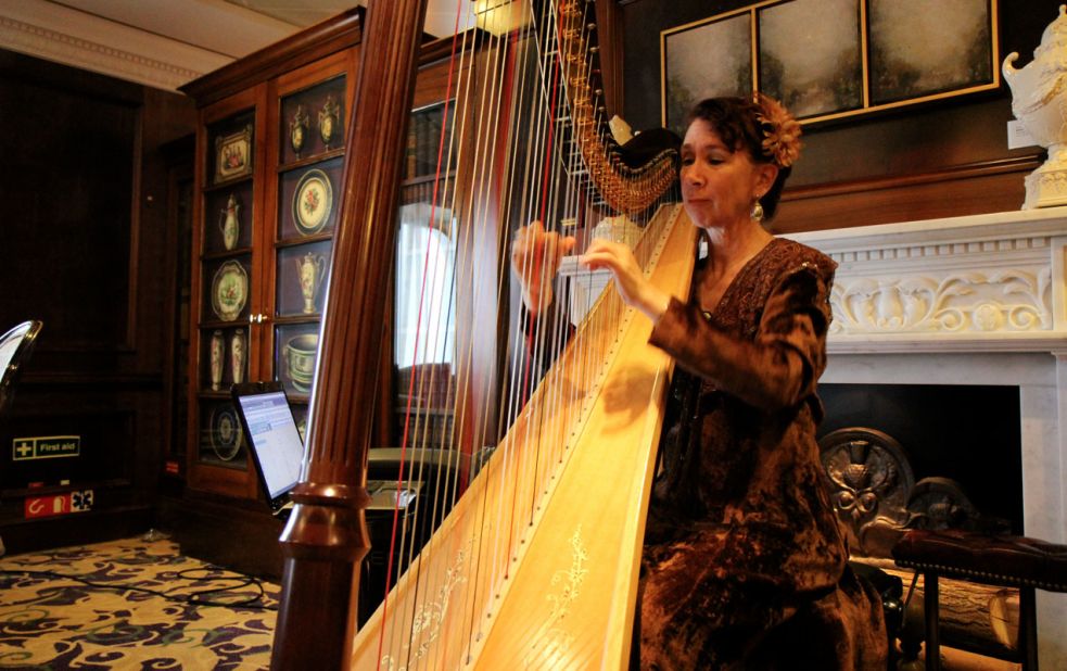 Mary Amanda Fairchild plays the harp aboard the Azamara Journey.
