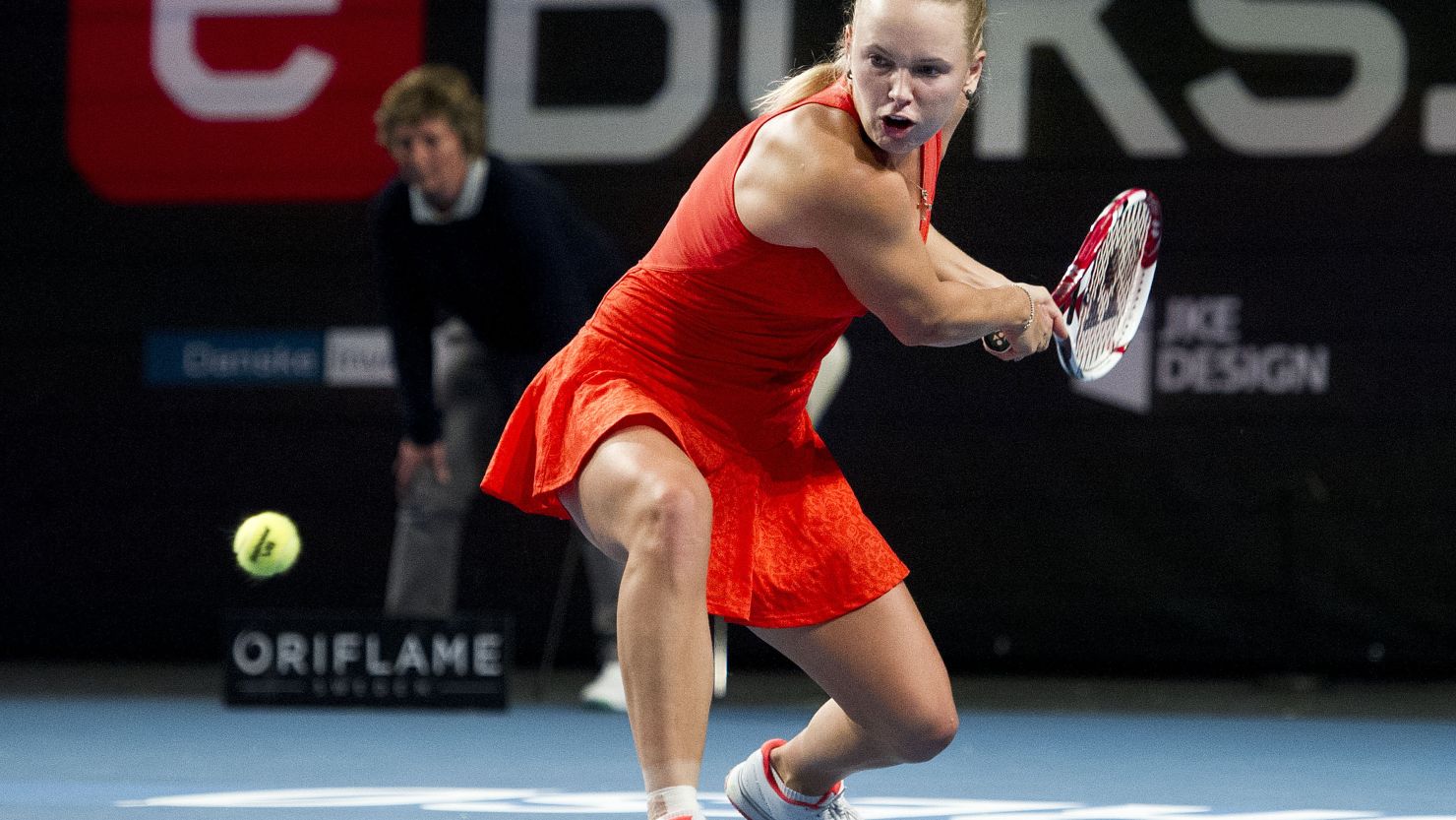 Caroline Wozniacki bends low to make a return during her straight sets quarterfinal win over Alize Cornet in Copenhagen.