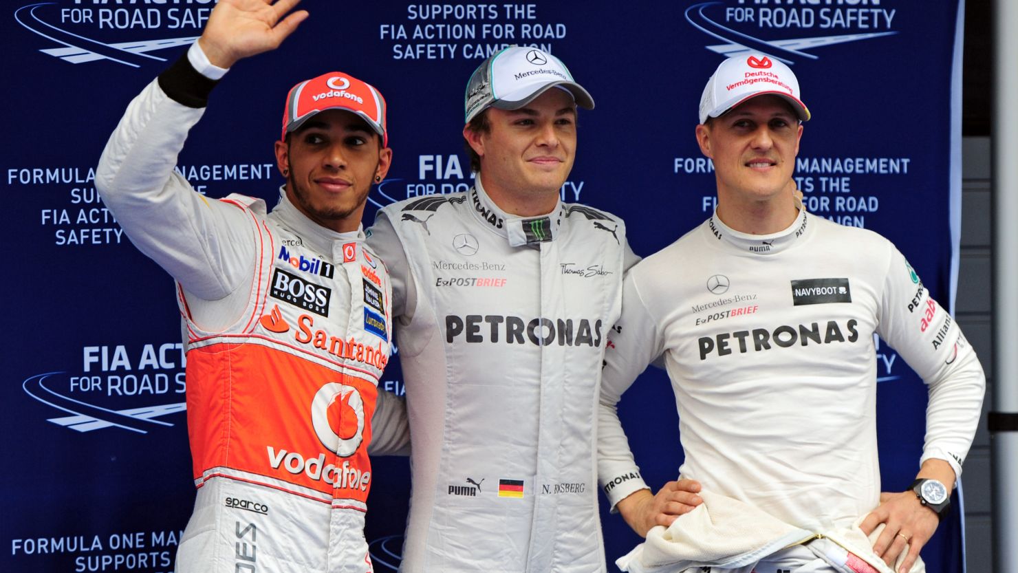 Nico Rosberg (center) flanked by Lewis Hamilton and Michael Schumacher after the qualifying session at the Chinese Grand Prix 