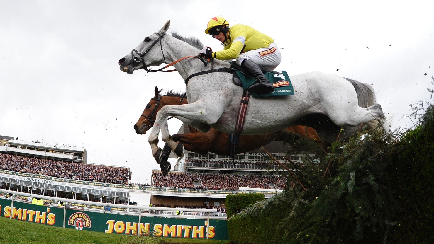 Neptune Collonges ridden by Daryl Jacob jumps the water jump during the Grand National at Aintree Racecourse in Liverpool, UK.