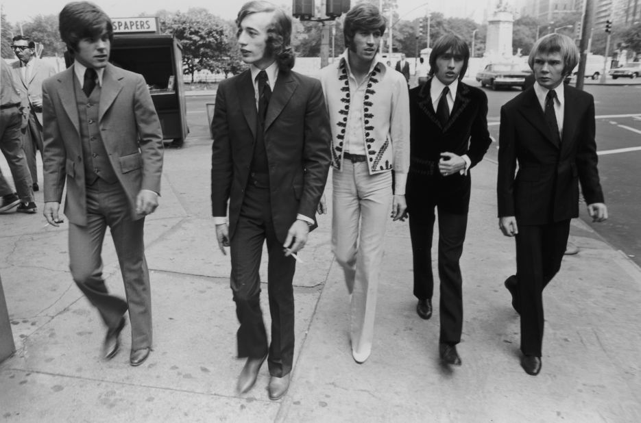 The Bee Gees walk down a New York City Street in 1968. From left to right, bassist Vince Melouney, Robin Gibb, Barry  Gibb, Maurice Gibb, and drummer Colin Peterson.