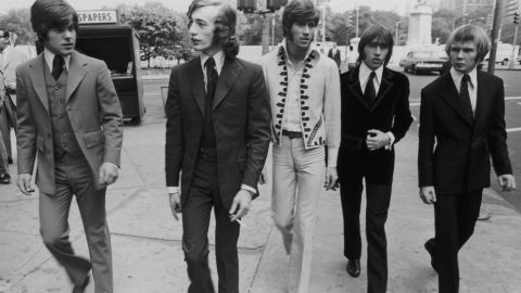 The Bee Gees walk down a New York City Street in 1968. From left to right, bassist Vince Melouney, Robin Gibb, Barry Gibb, Maurice Gibb, and drummer Colin Peterson.