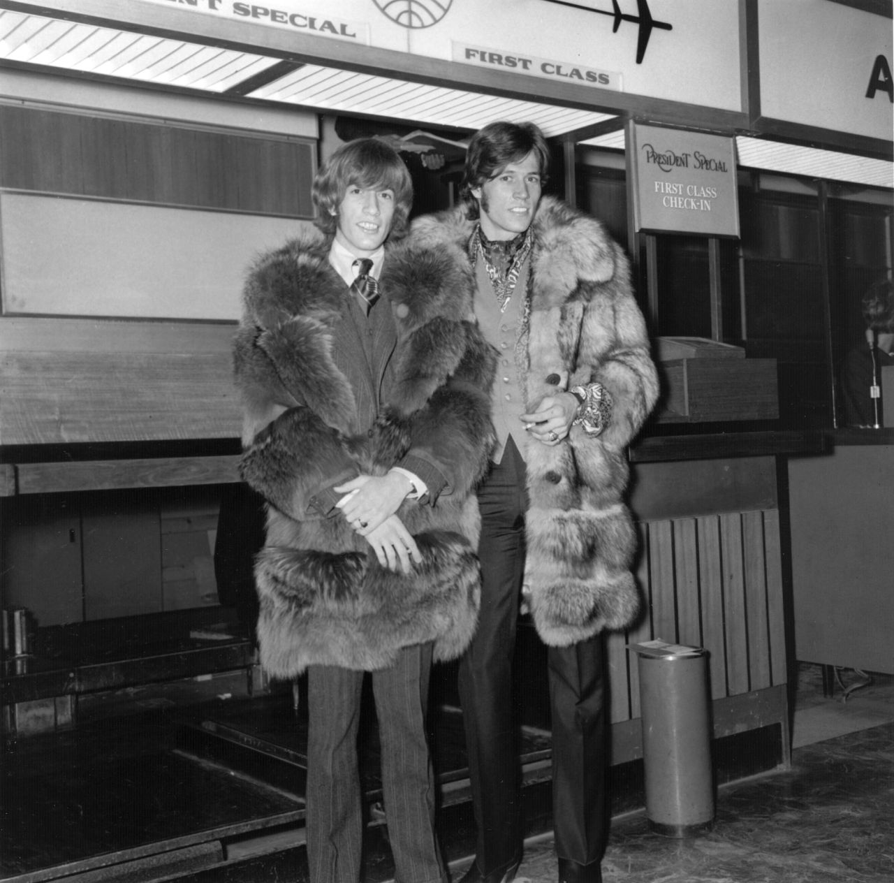 Robin Gibb, left, and brother Barry at London's Heathrow Airport in 1967. 