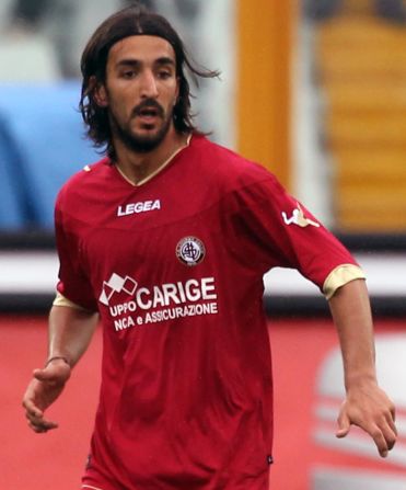Livorno midfielder Piermario Morosini playing against Pescara on Saturday. The former Italy under-21 international collapsed during the game against Pescara and later died in hospital. 