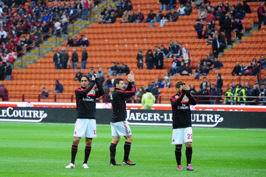 AC Milan's players acknowledge the crowd after the cancellation of the Serie A match against Genoa on Saturday.