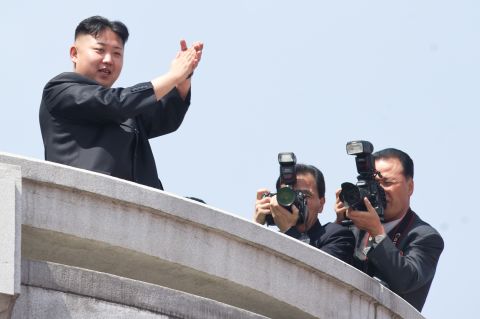 North Korean leader Kim Jong Un, left,  watches a military parade in Pyongyang in honour of the 100th birthday of his grandfather, the late North Korean leader Kim Il Sung.