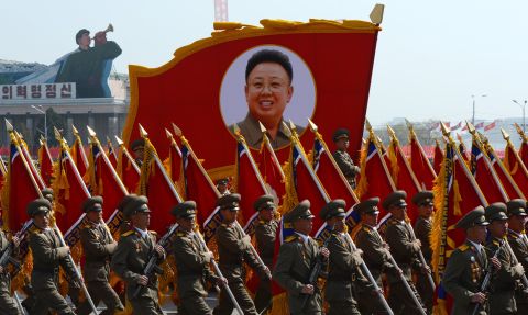 North Korean soldiers carry a portrait of late leader Kim Jong-Il during a military parade to mark 100 years since the birth of the country's founder Kim Il-Sung in Pyongyang on April 15, 2012. T