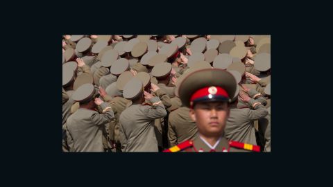 North Korean soldiers salute during a military parade to mark 100 years since the birth of the country's founder Kim Il-Sung on April 15.