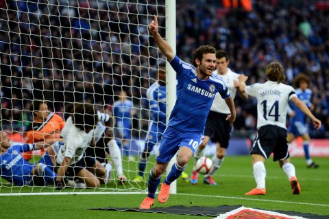 Chelsea versus Tottenham Hotspur again in the Premier League, this time in the semifinal of the 2012 FA Cup. Here, Juan Mata celebrates his goal despite the ball appearing to be blocked short of the line by a Tottenham defender. 