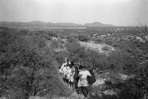 People cross the border in Sasabe, Arizona. A large number of immigrants cross the border in this mountainous area that has become the preferred spot to enter the United States.