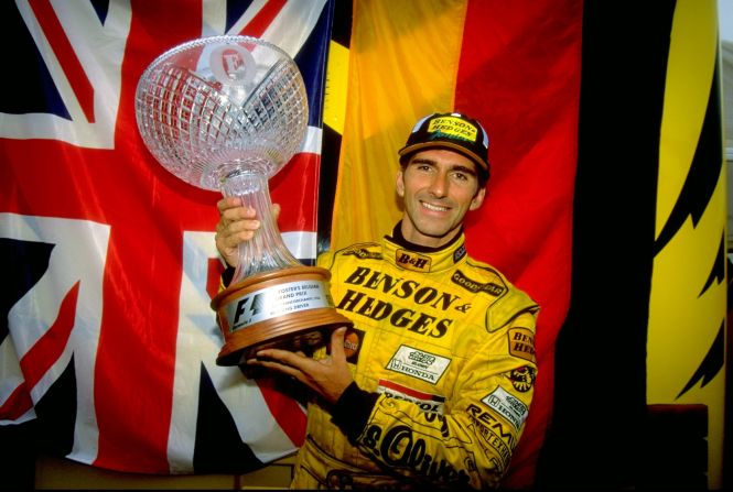 Damon Hill is one of Britain's most succesful drivers, winning 22 races in an eight-season career spanning from 1992 to 1999. Here he holds the trophy high after winning  the Belgian Grand Prix in 1993.