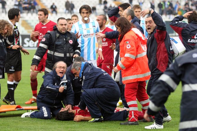 Emergency teams rush onto the pitch to treat Morosoni after his shock collapse. A defibrillator was used before an ambulance took the 25-year-old to Pescara's Santo Spirito hospital. Doctors tried unsuccessfully to revive him for 30 minutes.