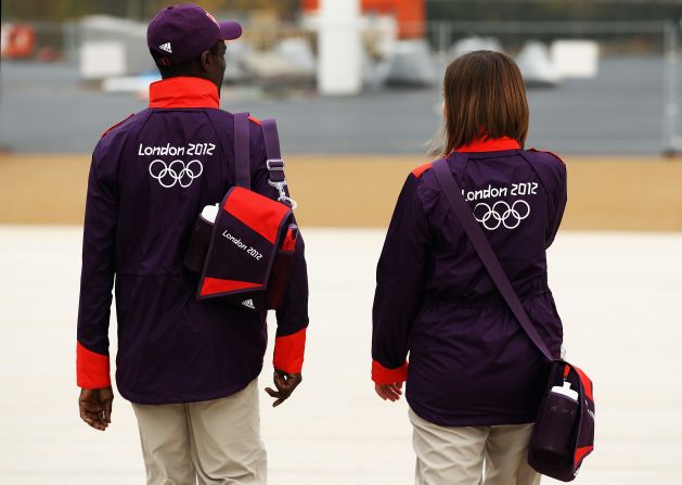 Models wear the Volunteers Uniform for London 2012 at a photocall at the Olympic Park on November 22, 2011.