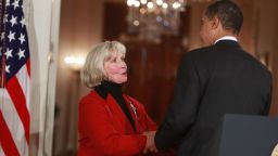 JANUARY 29: U.S. President Barack Obama walks with Lilly Ledbetter into the East Room before signing the 'Lilly Ledbetter Fair Pay Act during an event at the White House January 29, 2009 in Washington, DC. The The Lilly Ledbetter Fair Pay Act was recently passed by congress granting equal pay to all women.