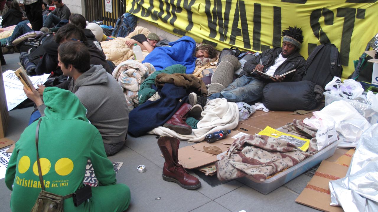 Occupy Wall Street supporters have moved their protests to sidewalks.