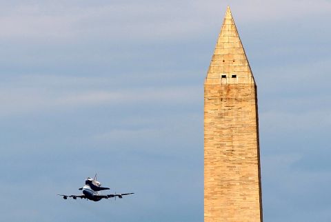 Space shuttle Discovery, mounted atop a 747 shuttle carrier aircraft, goes by the Washington Monument during a flyover of the nation's capital on its trip to retirement Tuesday, April 17. The flight -- the last time Discovery will be aloft -- took it from Florida's Kennedy Space Center to the Washington area, where it will spend retirement as a museum piece at an annex to the Smithsonian National Air & Space Museum in Chantilly, Virginia, near Dulles International Airport.