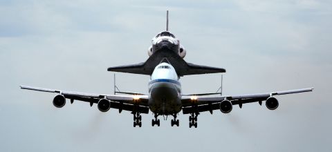The 747 shuttle carrier aircraft, carrying Discovery, prepares to land at Washington Dulles International Airport on Tuesday in Chantilly, Virginia.