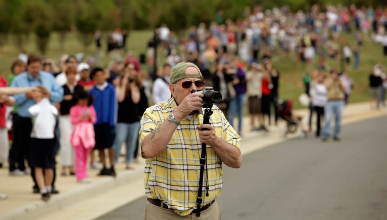 People gather to watch the arrival of Discovery at the Smithsonian National Air and Space Museum Steven F. Udvar-Hazy Center on Tuesday in Chantilly.