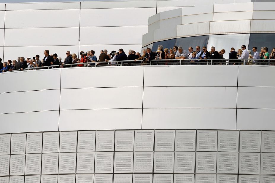Special guests watch the Discovery's arrival from the observation deck of the Smithsonian National Air and Space Museum Steven F. Udvar-Hazy Center on Tuesday in Chantilly.