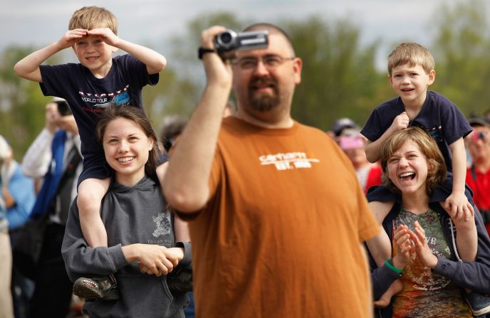 Spectators watch as Discovery passes over the Steven F. Udvar-Hazy Center on Tuesday.