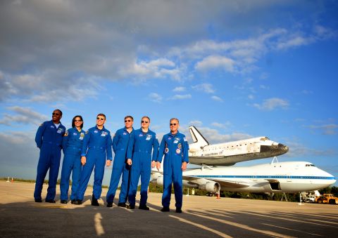 Alvin Drew, left, Nicole Stott, Mike Barratt, Steve Bowen, Eric Boe and Steve Lindsey of STS-133, Discovery's last crew, pose for a photo at Kennedy Space Center in  Cape Canaveral, Florida, on Monday, April 16.